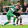 Simon Ludwig (links, grünes Trikot) wartet bei seinem neuen Verein Rot-Weiß Oberhausen noch auf seinen ersten Einsatz.. Foto: IMAGO/Zink/pmk